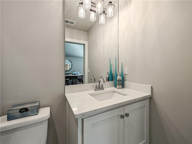 bathroom with vanity and toilet