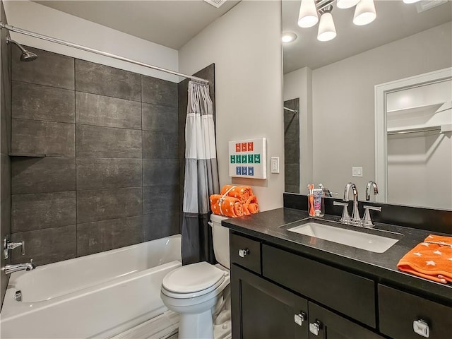 full bathroom with vanity, shower / tub combo with curtain, and toilet