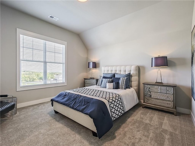 bedroom with lofted ceiling and carpet