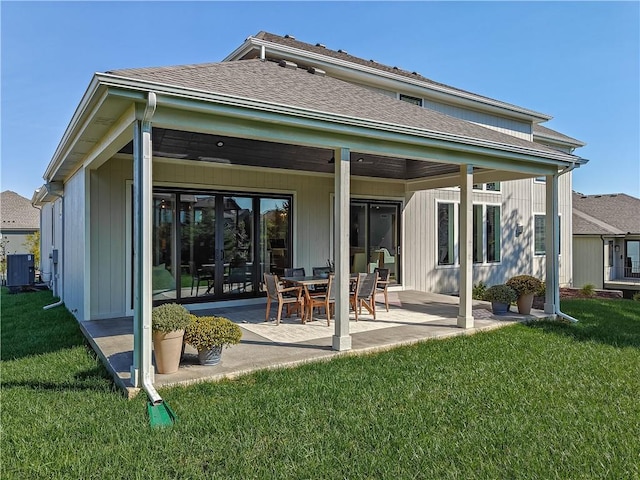 rear view of house featuring ceiling fan, a patio area, a lawn, and central air condition unit