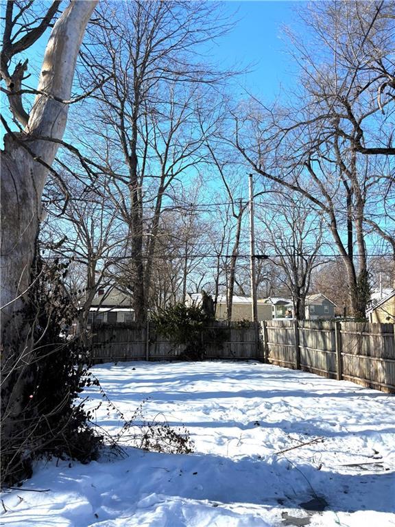 view of yard layered in snow