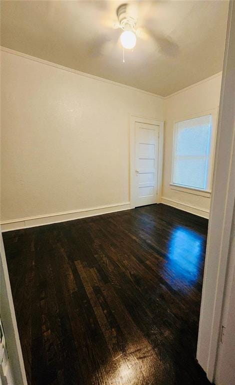 spare room with hardwood / wood-style flooring and ceiling fan