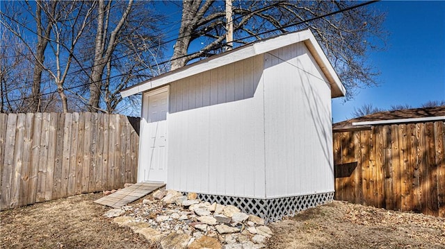 view of shed featuring a fenced backyard