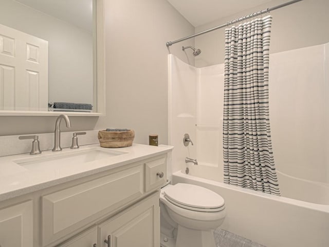 full bath with toilet, shower / bathtub combination with curtain, and vanity