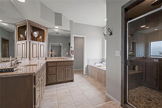 bathroom with vanity, shower with separate bathtub, and tile patterned flooring