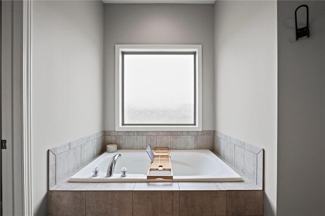 bathroom featuring tiled bath