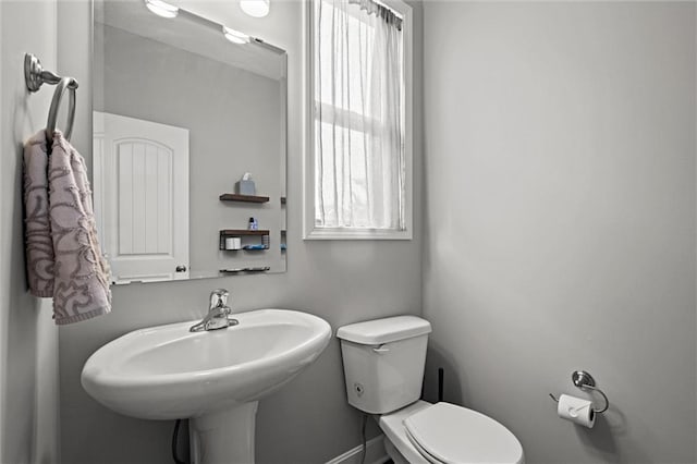 bathroom featuring sink and toilet