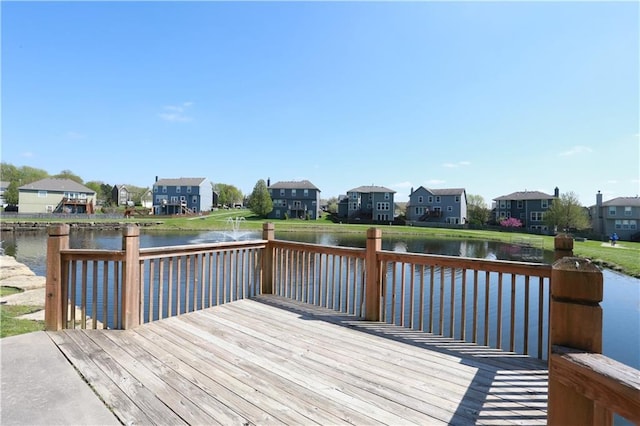 wooden deck featuring a water view