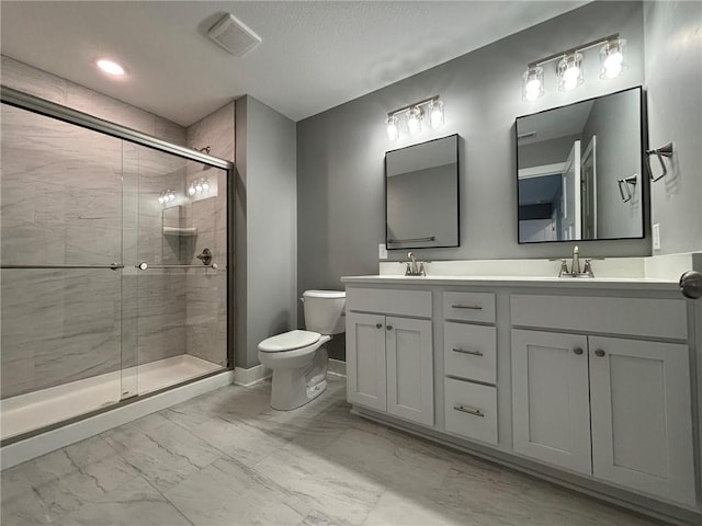 4909 S Creek Woods Dr, Saint Joseph, MO 64507 - bathroom with marble look tiles, double vanity, and a shower stall