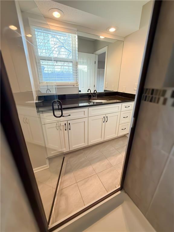 bathroom featuring tile patterned floors and vanity