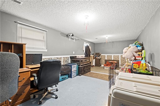 home office featuring a textured ceiling