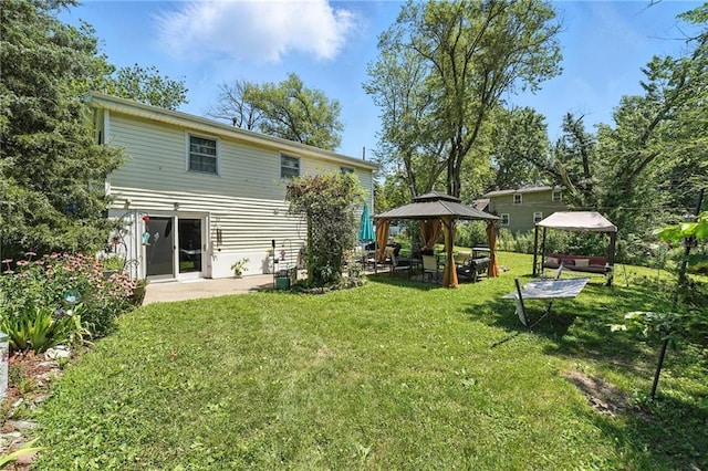 746 Salem Rd, Excelsior Springs, MO 64024 - rear view of house with a gazebo and a lawn
