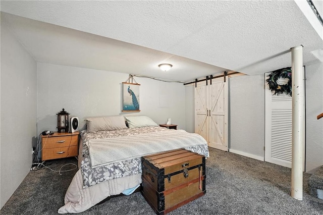746 Salem Rd, Excelsior Springs, MO 64024 - bedroom featuring dark carpet, a barn door, and a textured ceiling