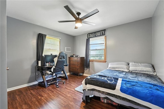 746 Salem Rd, Excelsior Springs, MO 64024 - bedroom with multiple windows, wood finished floors, a ceiling fan, and a desk