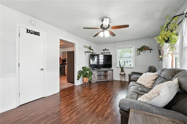 746 Salem Rd, Excelsior Springs, MO 64024 - living area featuring ceiling fan, dark wood-type flooring, and a wainscoted wall