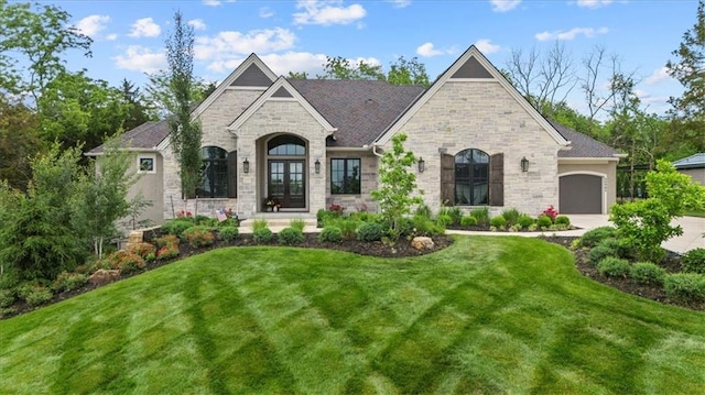 24982 W 106th Ct, Olathe, KS 66061 - french country inspired facade featuring stone siding and a front yard
