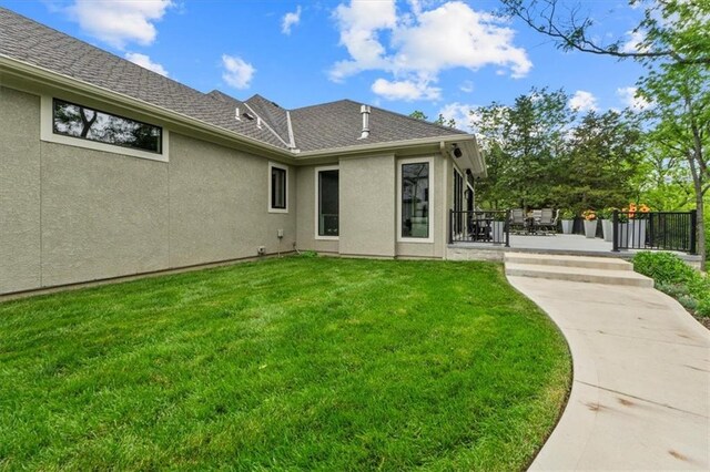 24982 W 106th Ct, Olathe, KS 66061 - back of property with stucco siding and a patio area