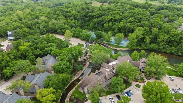 24982 W 106th Ct, Olathe, KS 66061 - aerial perspective of suburban area with a heavily wooded area