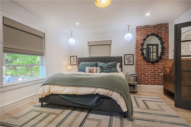 bedroom featuring recessed lighting, wood finished floors, and baseboards