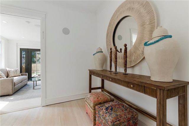 interior space with wood finished floors and baseboards