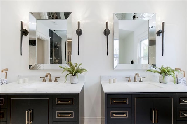 full bathroom with two vanities and a sink