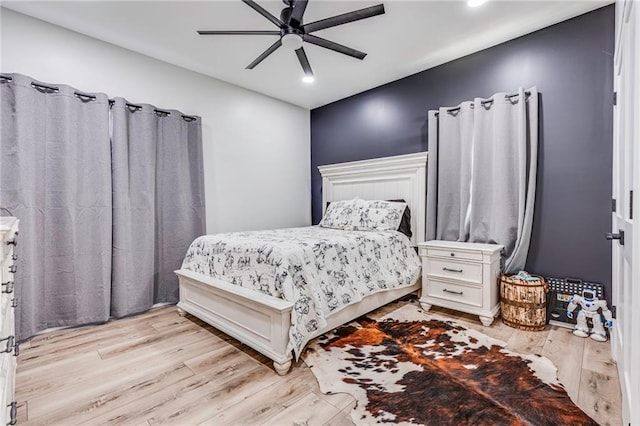 bedroom featuring ceiling fan and light hardwood / wood-style floors