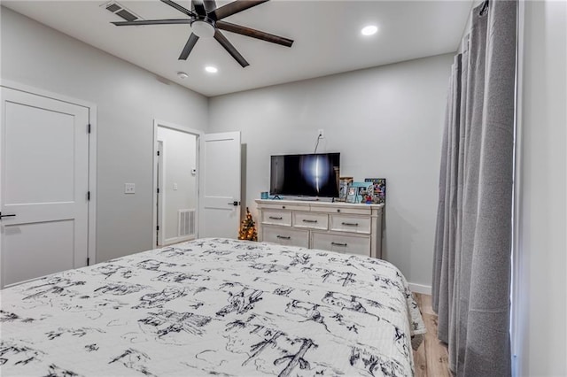 bedroom featuring ceiling fan and light hardwood / wood-style flooring