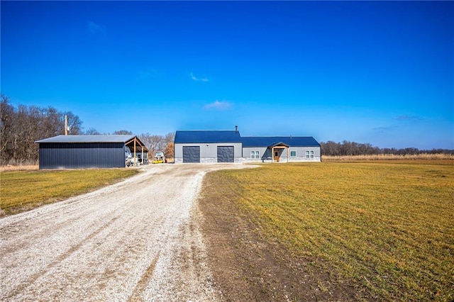 view of front of house with an outbuilding and a front yard