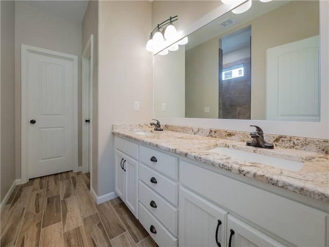 bathroom featuring vanity and hardwood / wood-style floors