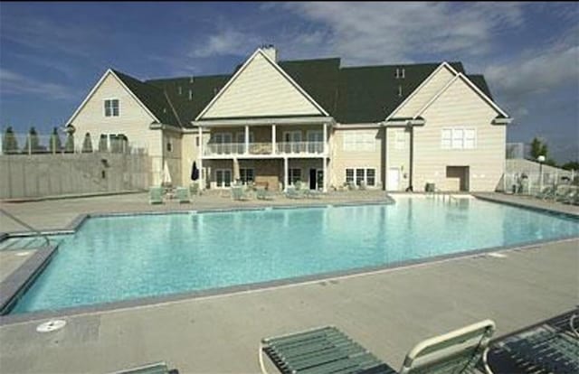 view of swimming pool with a patio area