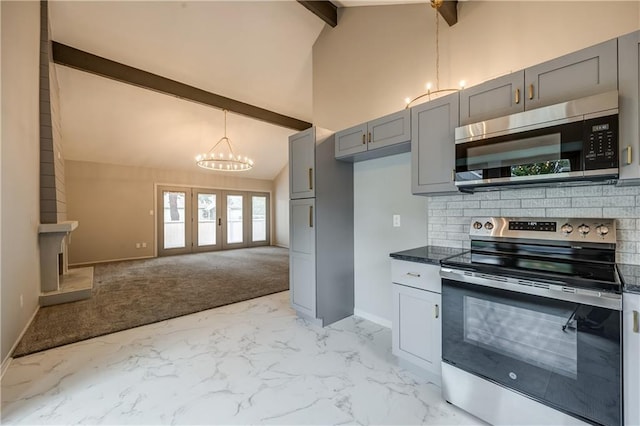 kitchen featuring appliances with stainless steel finishes, beamed ceiling, gray cabinetry, backsplash, and a chandelier