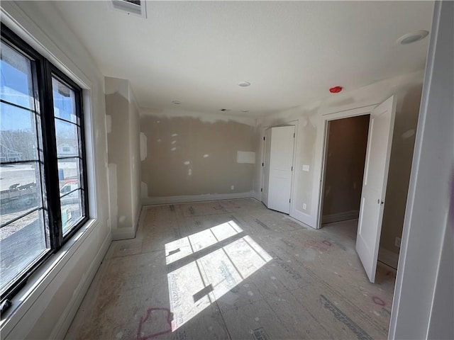 spare room with plenty of natural light