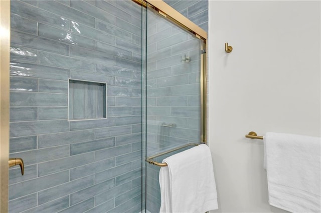 bathroom with a shower with shower door