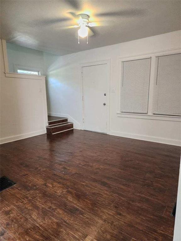 spare room with dark wood-type flooring and a textured ceiling