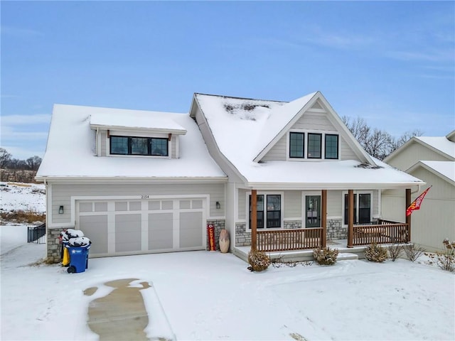 view of front of property featuring a porch and a garage