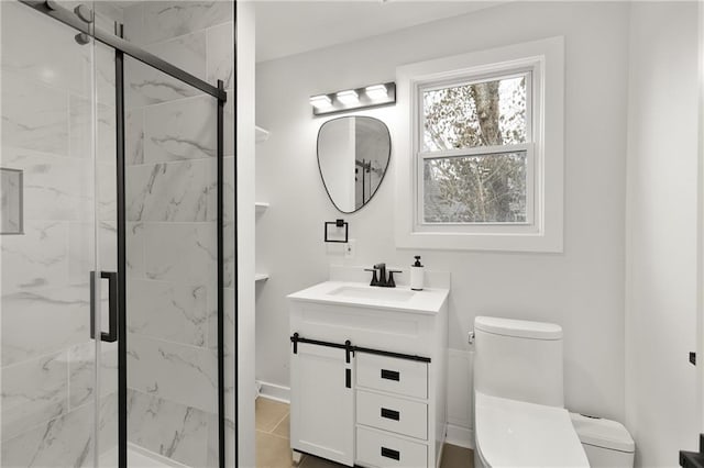 full bath featuring toilet, a marble finish shower, and vanity