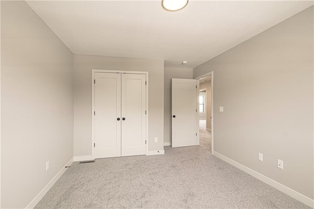 2327 Fishing Ln, Kearney, MO 64060 - unfurnished bedroom featuring baseboards, carpet floors, and a closet