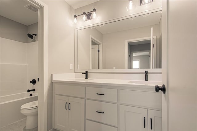 2327 Fishing Ln, Kearney, MO 64060 - bathroom featuring double vanity, toilet, and bathing tub / shower combination