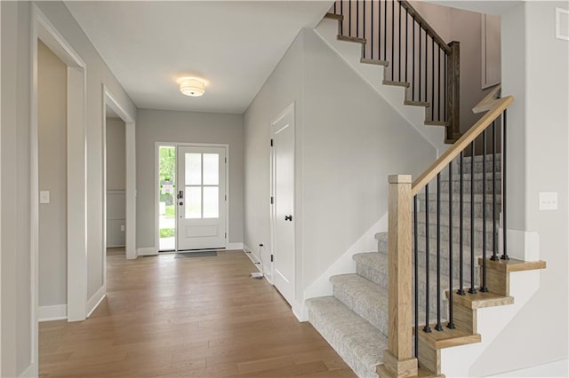2327 Fishing Ln, Kearney, MO 64060 - entrance foyer featuring wood finished floors, stairs, and baseboards
