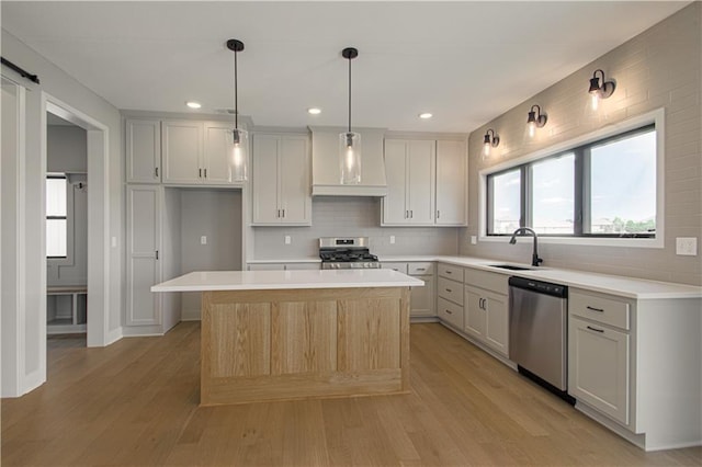 2327 Fishing Ln, Kearney, MO 64060 - kitchen featuring stainless steel appliances, premium range hood, backsplash, light countertops, and recessed lighting