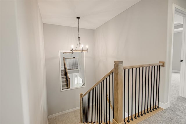 2327 Fishing Ln, Kearney, MO 64060 - stairs featuring carpet flooring, a chandelier, and baseboards