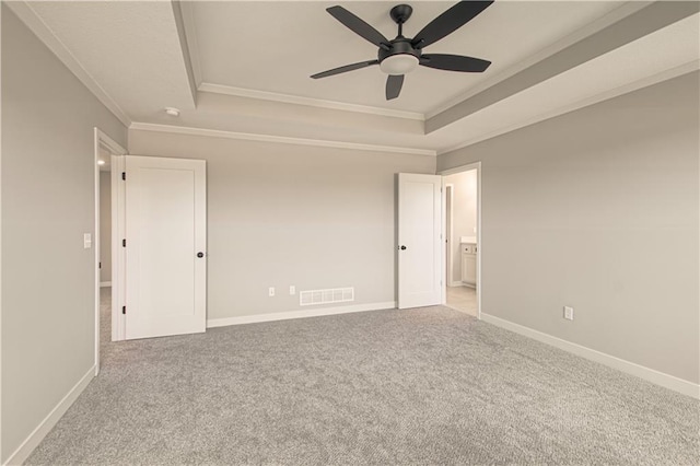 2327 Fishing Ln, Kearney, MO 64060 - empty room featuring a raised ceiling, a ceiling fan, crown molding, carpet floors, and baseboards
