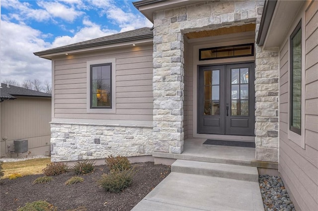 doorway to property with cooling unit and french doors