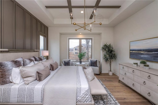 bedroom with coffered ceiling, light hardwood / wood-style flooring, and beamed ceiling