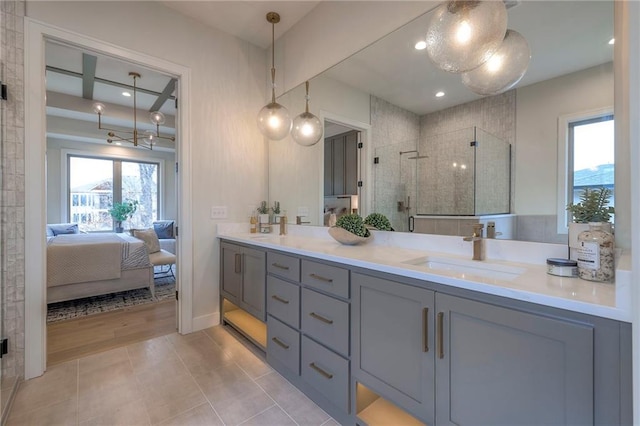 bathroom featuring walk in shower, tile patterned floors, and vanity