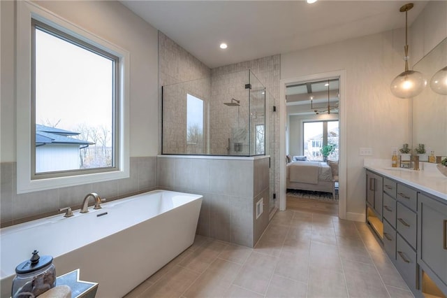 bathroom featuring vanity, tile patterned floors, and independent shower and bath