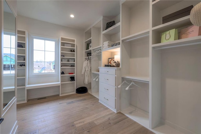 walk in closet featuring light hardwood / wood-style floors