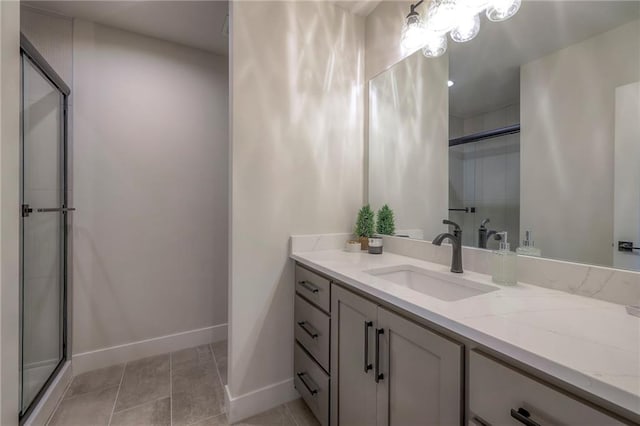 bathroom featuring vanity, tile patterned floors, and walk in shower