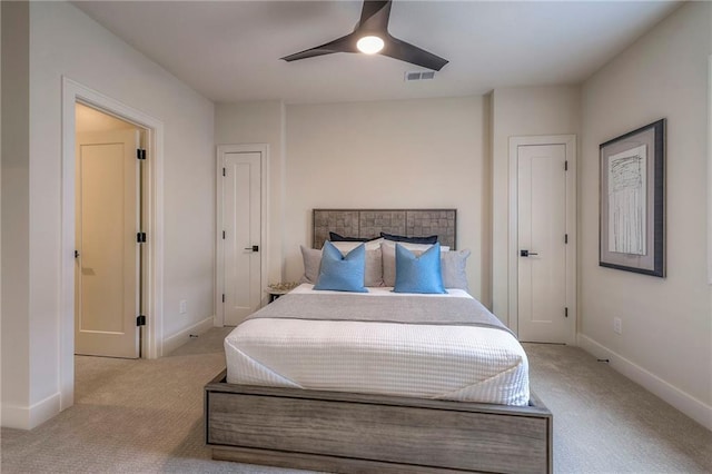 carpeted bedroom with ceiling fan