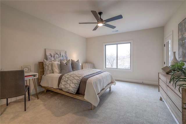 bedroom with light colored carpet and ceiling fan